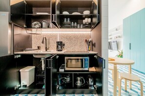 Fridge, microwave, stovetop, coffee/tea maker