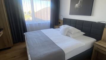 Comfort Room | 1 bedroom, in-room safe, individually decorated, desk