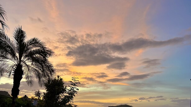 An infinity pool with a view of a sunset and mountains. - Seaside Serenity; 2b/2b with Panoramic Terrace (Playas Del Coco)