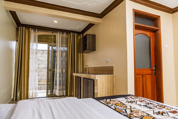 Garden View Deluxe Rooms(Five Units) | 1 bedroom, in-room safe, individually furnished, desk - Triple Tee Gardens & Accomodation (Kampala)