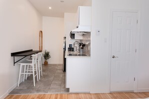 Fridge, microwave, stovetop, coffee/tea maker