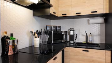 Fridge, microwave, stovetop, coffee/tea maker