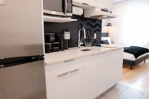 Fridge, microwave, stovetop, coffee/tea maker