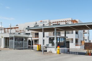 A modern building with a sign reading "Azure" and a covered entrance. - Azure 32 (Cape Town)