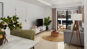 A modern living room with a sofa, a coffee table, a TV, and a dining area with a table and chairs. - Azure 32 (Cape Town)
