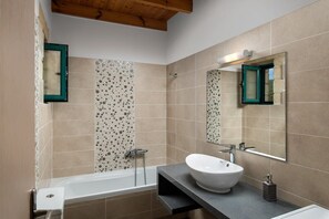 Bathtub, hair dryer, towels, soap