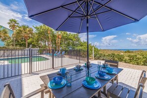 Outdoor dining - Casa Al Mare 102 – Beachfront Luxury w/ Saltwater Pool, Private Trail, Balconies & Sunset Views (Indian Rocks Beach)