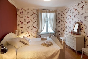 Habitación doble, vista al jardín | Área de sala de estar