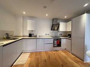 Apartment | Private kitchen | Fridge, microwave, oven, stovetop