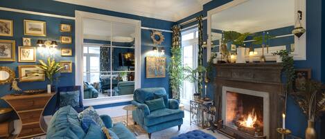 Villa | Living area | TV, fireplace