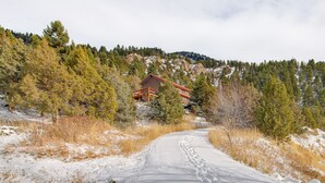 A snow-covered path leading to a cabin surrounded by trees and a mountain. - Secluded Livingston Retreat w/ Deck + Fire Pit! (Livingston)