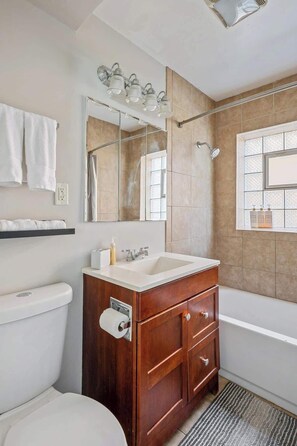 Bathtub, hair dryer, towels