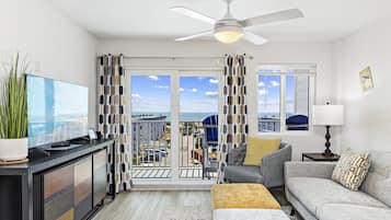 Signature Apartment, 2 Bedrooms, Non Smoking, Balcony | Living room | 55-inch Smart TV with cable channels