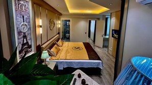 A modern hotel room with a bed, a large poster of the Eiffel Tower, a nightstand, and a bathroom visible through an open door. - Paradise Suit Otel  (Beysehir)