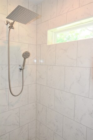 Bathtub, hair dryer, towels, soap