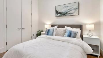 1 bedroom, desk, iron/ironing board, travel crib