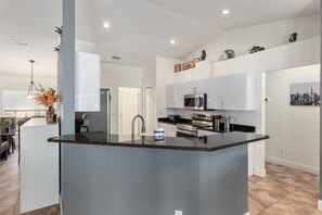 Fridge, coffee/tea maker, cookware/dishes/utensils