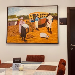 A painting of people working with sacks, a bus, and a sign reading "Office" on a wall. - Guided Hospitality (Lagos)