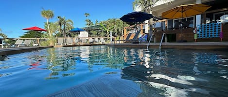 Outdoor pool, pool umbrellas, sun loungers