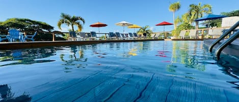 Outdoor pool, pool umbrellas, sun loungers