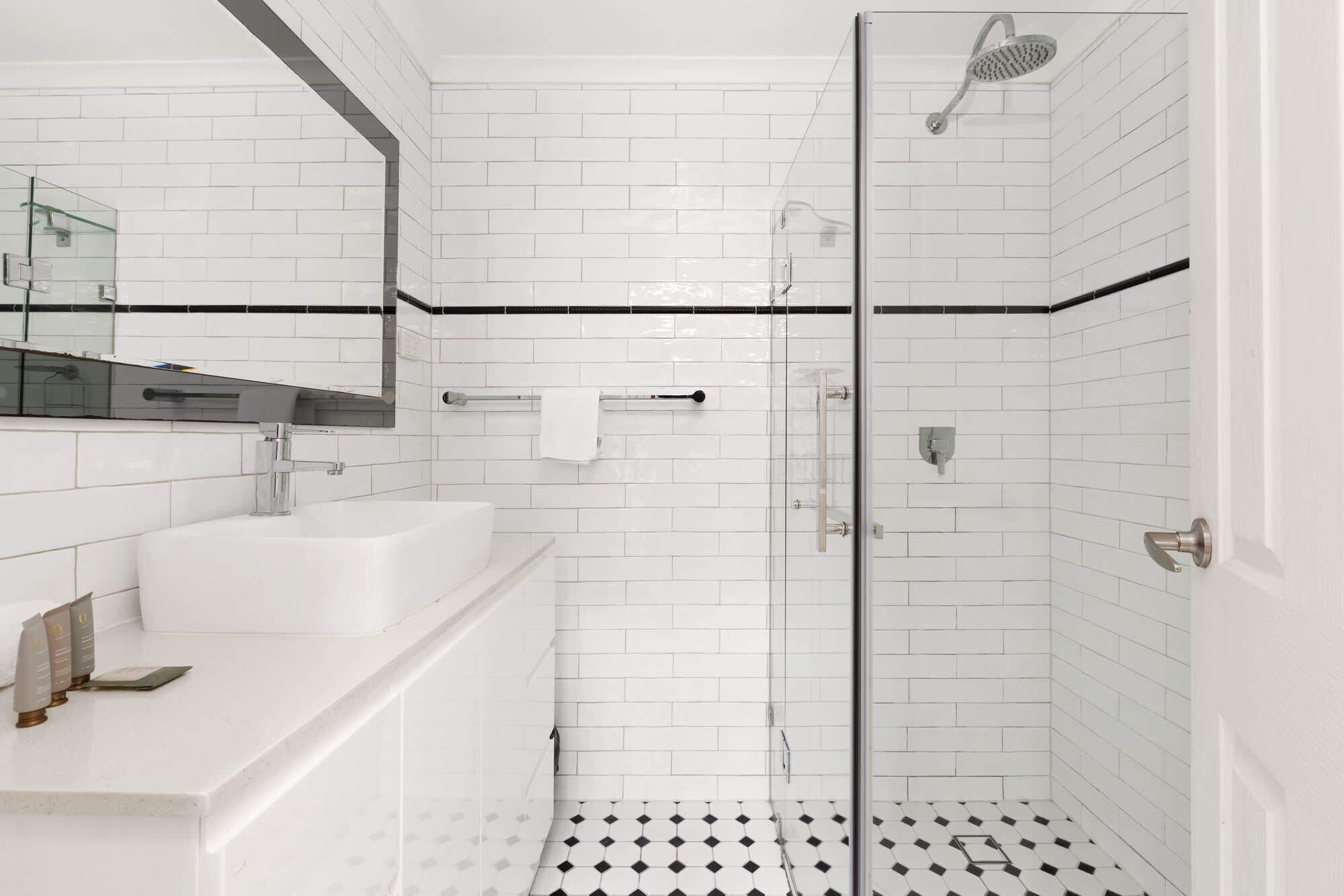 Shower, hair dryer, towels, shampoo