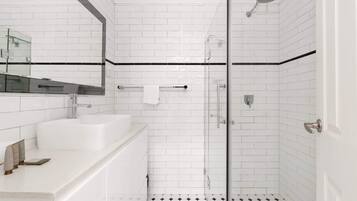 Shower, hair dryer, towels, shampoo
