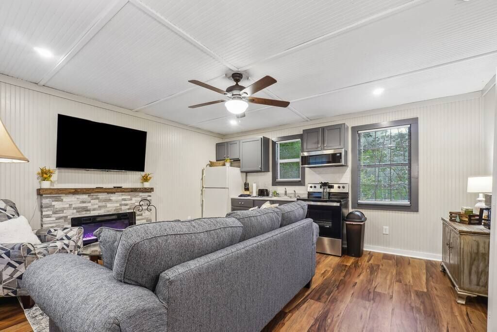 Nicely appointed living room/ kitchen area.