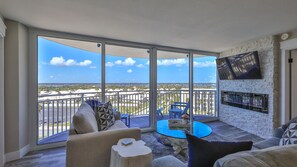 TV, fireplace, ping pong - SUNSHINE AND SEASHELLS Luxury 2 BR Beach Condo, Pool, Hot tub, Game rooms, Wifi (Daytona Beach Shores)