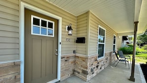 A house with a beige exterior, a brown front door, and a stone accent wall. - 430 Ridgelawn · Brand New Home Walking distance to Spooky Nook (Hamilton)