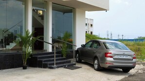A building with a sign reading "FLORA PAVILLION". - Flora Pavillion Near Global Hospital Perumbakkam (Chennai)