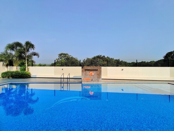 A swimming pool with a sign that reads "LION Signature" and "FOK." - Lion Signature Family Resort (Talala)
