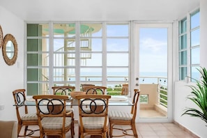 The dining room table comfortably seats 6 guests and offer beautiful views.