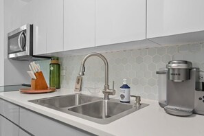 Fridge, microwave, stovetop, coffee/tea maker