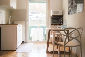 Standard Apartment, 1 King Bed, Balcony | Private kitchen | Microwave, stovetop, toaster, highchair