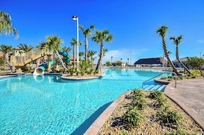 The lazy river and water slides at Vista Cay Resort offer guests an exhilarating way to relax and enjoy the sun. Glide along the lazy river or experience the thrill of the water slides. - Resort Access 5BR Oasis w Pool, Game Room near WDW (Kissimmee)