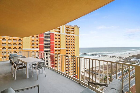 A balcony with a view of the ocean and a high-rise building with balconies. - 🏖️ADA Compliant Master-Great Gulf Views-Corine's Corner🏖️ (Panama City Beach)