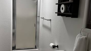 Shower, hair dryer, towels, soap
