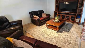 Smart TV, DVD player, foosball, books