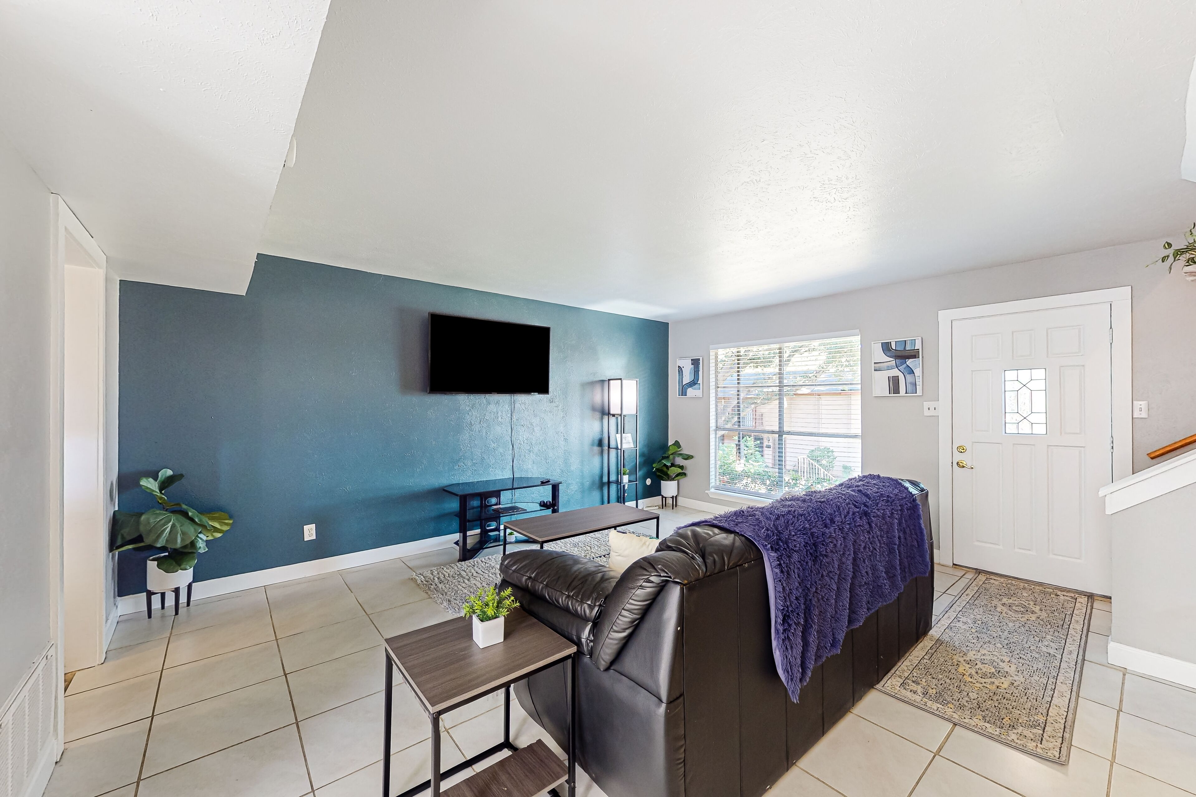 Courtyard-style condo with on-site pool, private balcony, & in-home bar
