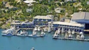 An aerial view of a marina with multiple docks and boats. - Peaceful & Private Waterfront Retreat w/Heated Pool near Beach & Downtown Stuart (Stuart)