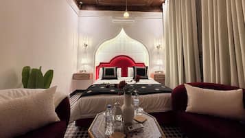 Deluxe Suite, 1 Bedroom, Non Smoking, Courtyard View | 4 bedrooms, individually decorated, individually furnished