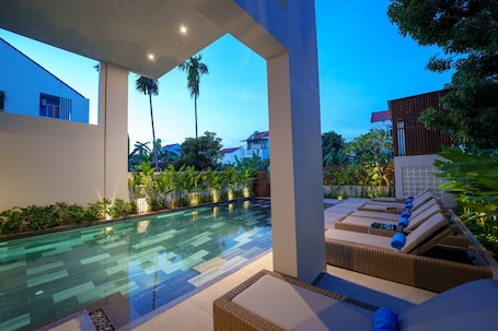Outdoor pool, pool umbrellas. Cozy An Boutique Hotel Hoian