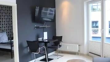 Comfort Apartment | Living area | 40-inch LCD TV with satellite channels