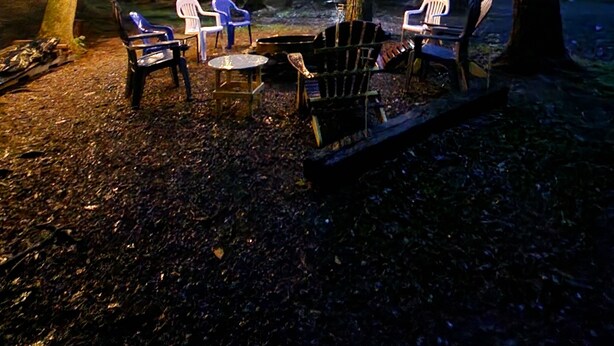 An outdoor seating area with string lights, chairs, and a fire pit. - Cabin in Waterville- conv location, close to rail trail and Big Pine Creek (Waterville)