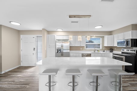 Fridge, microwave, oven, stovetop. "Charming Cape Coral Home: Gulf Access, Walk to Yacht Club, Beach & Downtown"