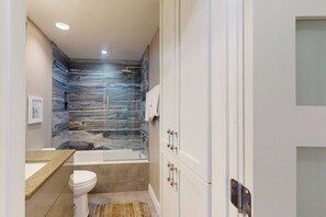 Shower, hair dryer, towels, shampoo