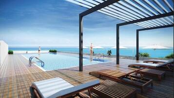 Outdoor pool, open 7:00 AM to 9:30 PM, pool umbrellas