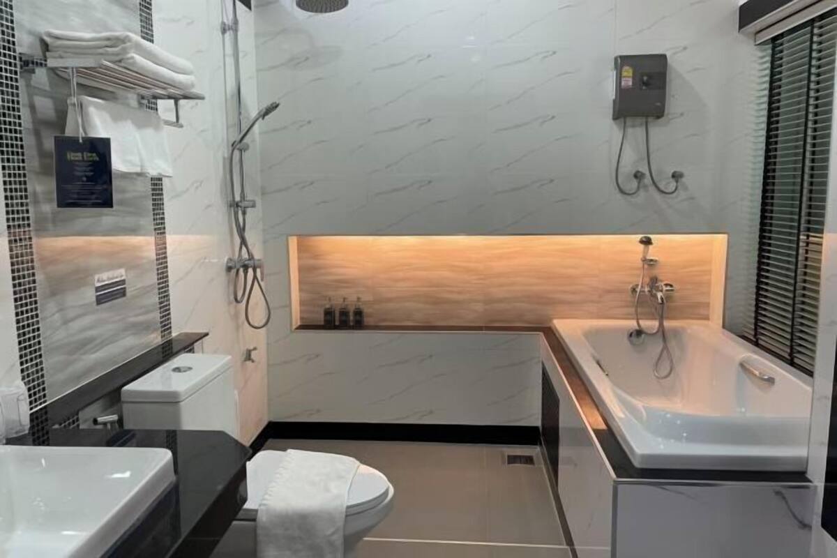 Bathroom | Hair dryer, slippers, towels, soap