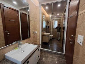 Shower, towels, soap, toilet paper