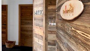 A wooden reception desk with a sign that reads "Bellarosi." - Cosy apartment for 6 in Les Gets with WIFI and terrace (Les Gets)
